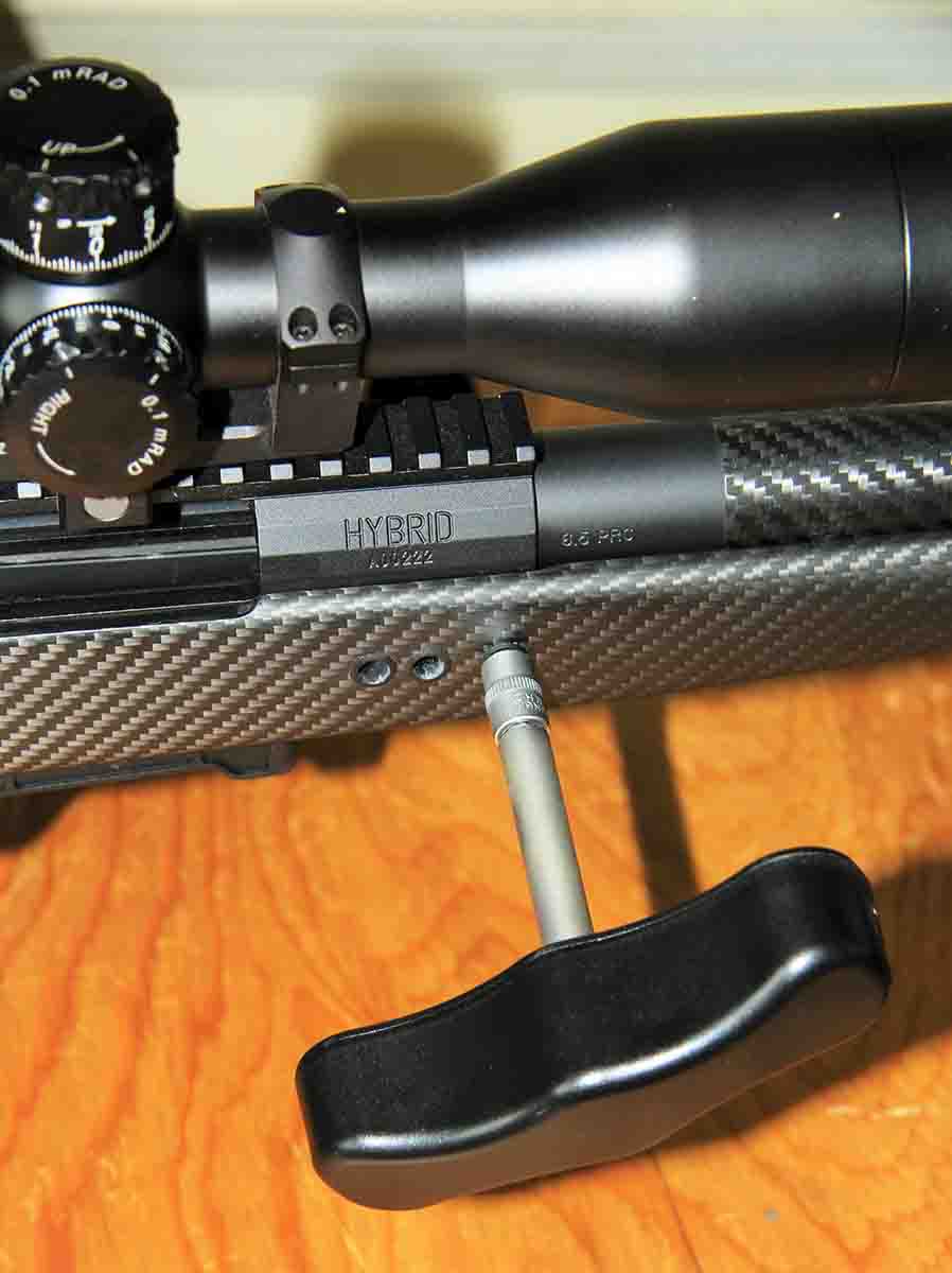 The takedown system of the Hardy Rifle includes three bolts accessed through the side of the carbon stock. A torque wrench is supplied to apply the proper pressure during tightening.
